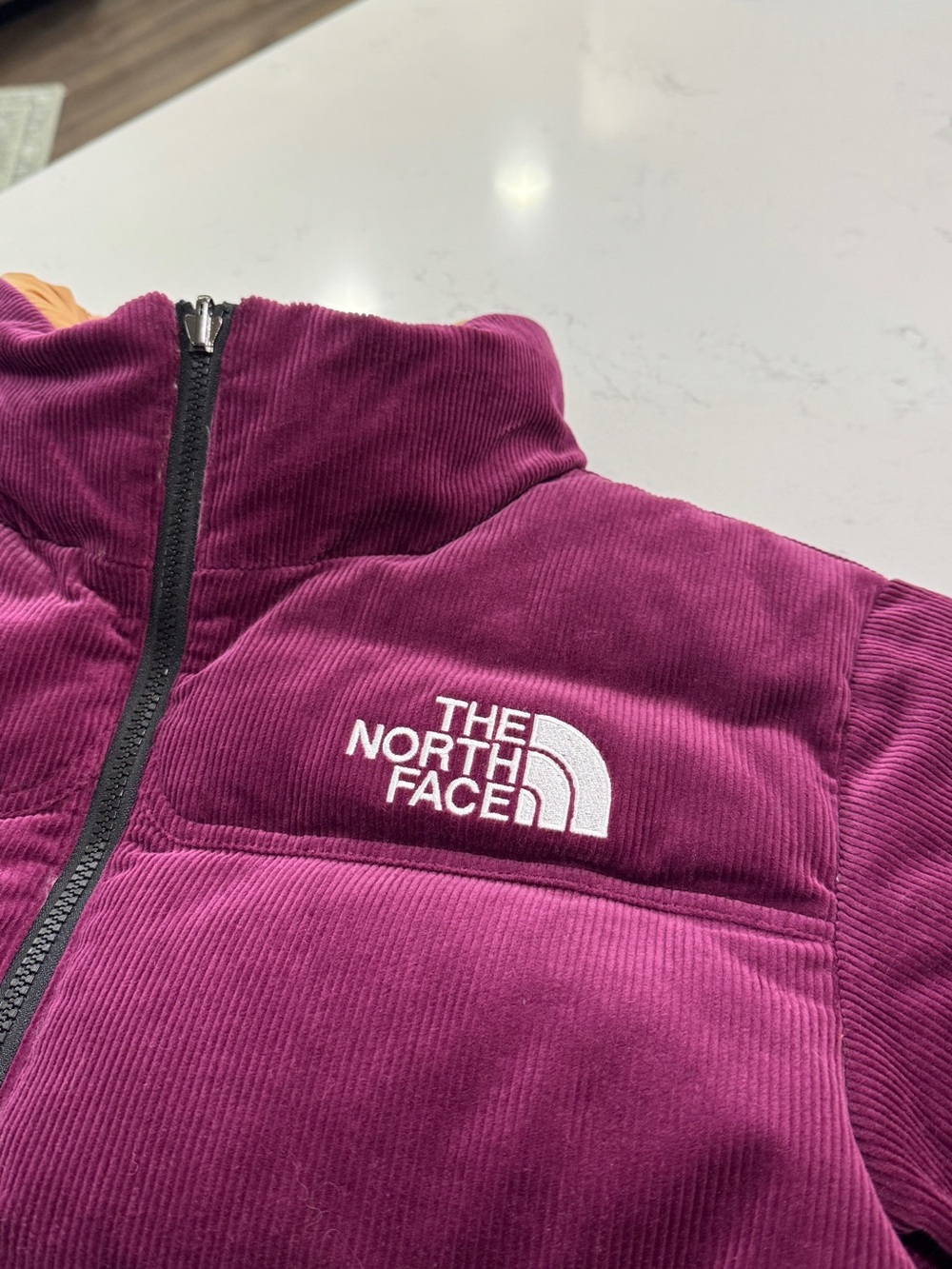 The North Face Women's 92 Reversible Corduroy Nuptse Jacket in Boysenberry - Picture 6 of 6